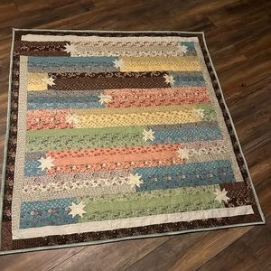 Hand sewn and machine quilted throw. Made in 2024